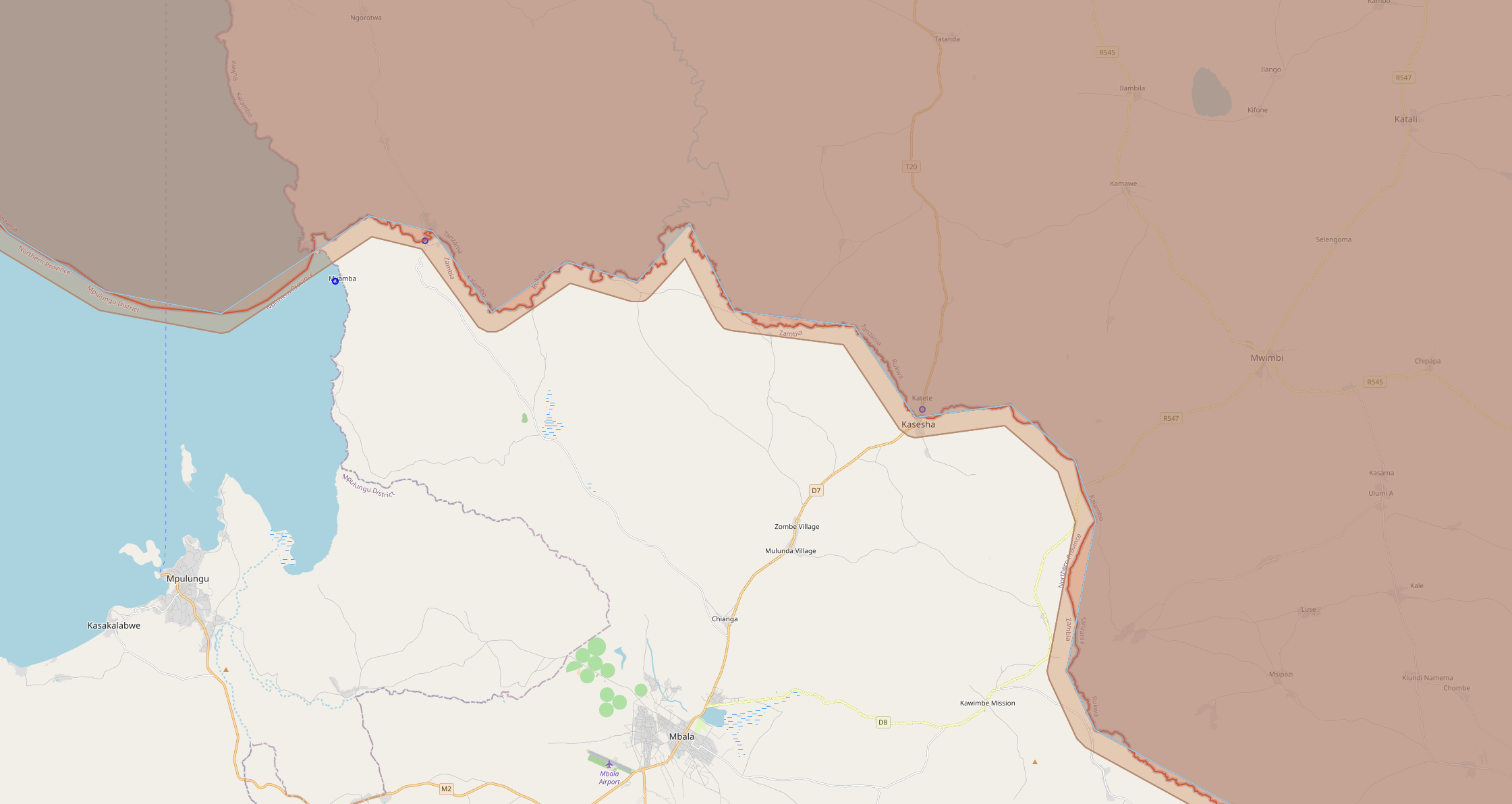 Tanzania's coastline with original and simplified polygon layers — the simplified boundary cuts through inlets while the buffer expands to cover them